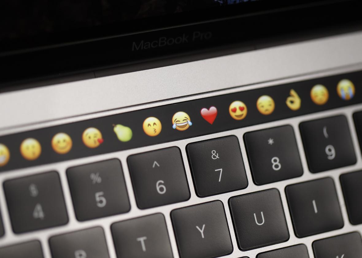 618595354-emoticons-are-displayed-on-the-touch-bar-on-a-new-apple