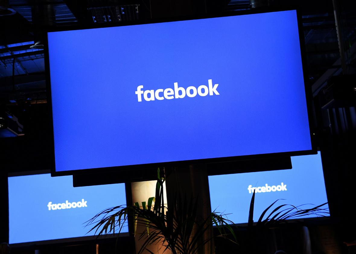 613799052-facebook-logo-is-pictured-on-a-screen-ahead-of-a-press