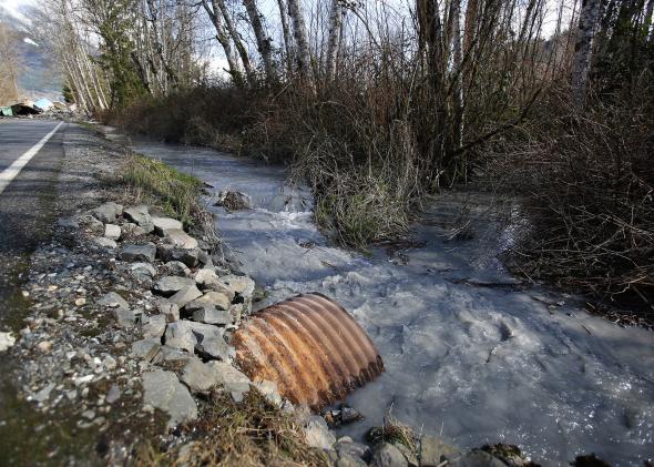 480251731-steady-stream-of-mud-and-water-flows-away-from-the A creek