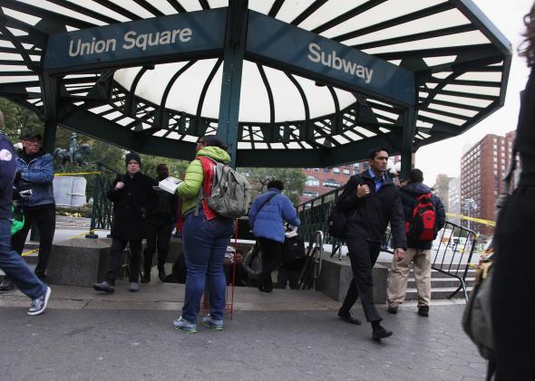 155559120-commuters-enter-and-exit-the-union-square-subway