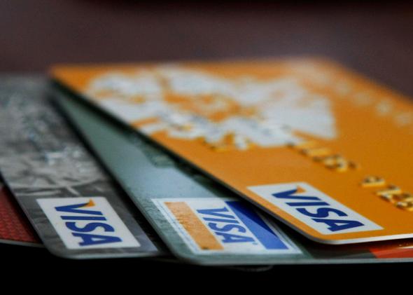 79989021-visa-credit-cards-are-arranged-on-a-desk-february-25