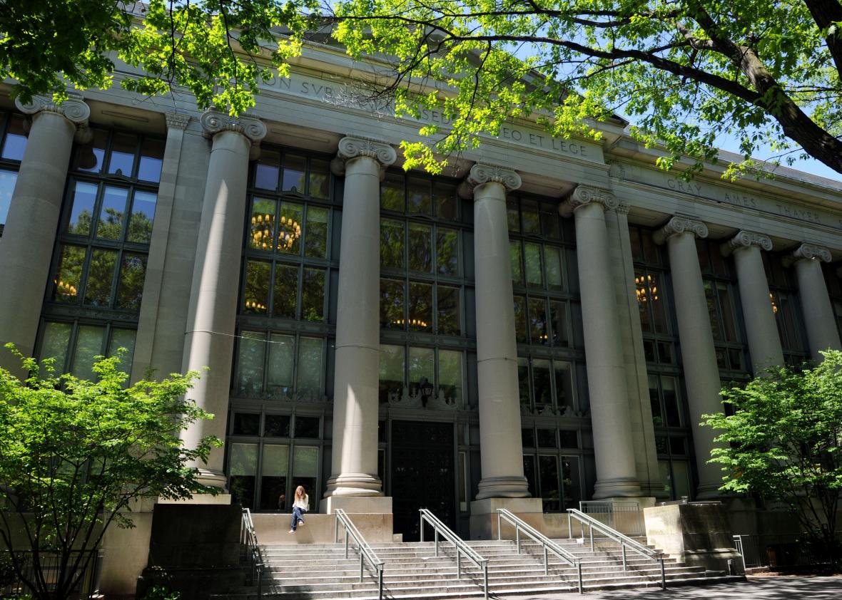 98954114-woman-sits-outside-harvard-law-schools-langdell-hall-may