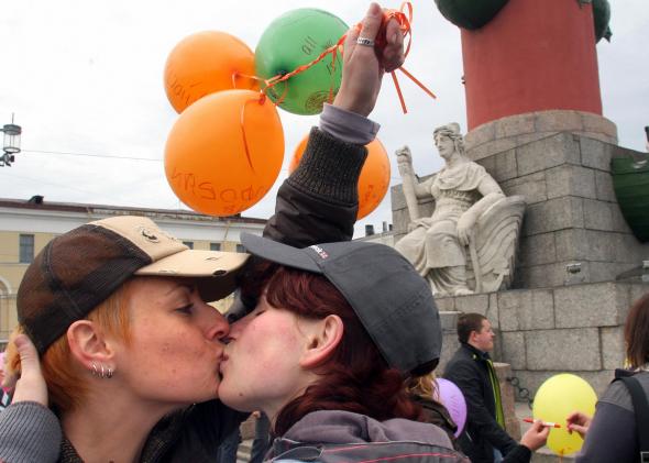 Lesbians kiss during a 2009 gay rights rally in St. Petersburg, Russia.