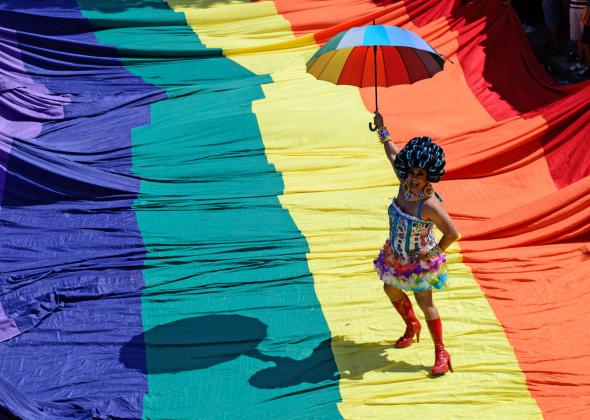 http://www.slate.com/content/dam/slate/blogs/outward/2015/06/18/moma_adds_the_rainbow_flag_to_design_collection_during_lgbtq_pride_month/459080120-reveller-poses-on-a-giant-rainbow-flag-during-the.jpg.CROP.promo-mediumlarge.jpg