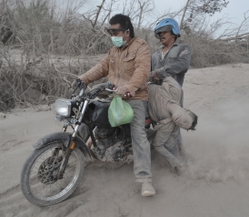 466314403-indonesian-residents-rescue-a-victim-following ,
