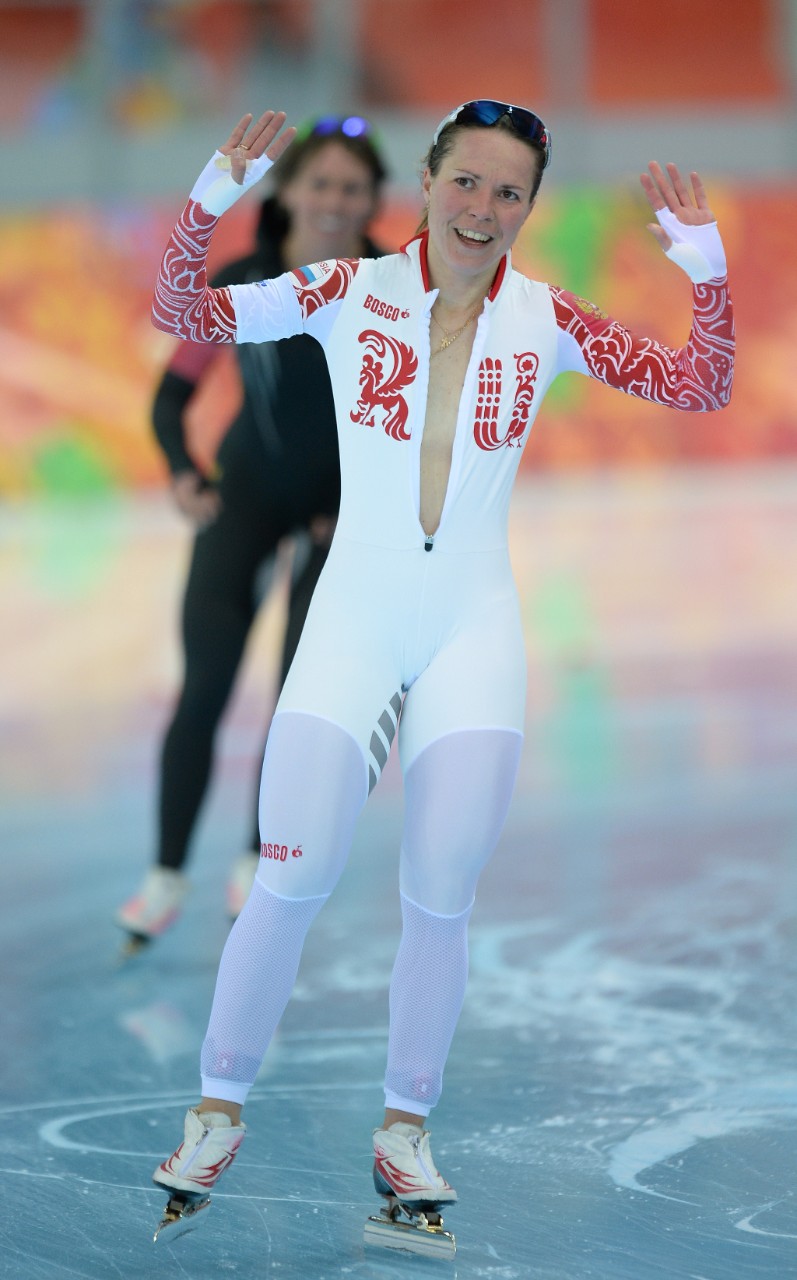 Olga Graf Russian speed skater unzips suit for accidental striptease.