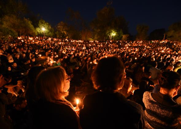 493685769-students-gathered-for-a-candlelight-vigil-on-the