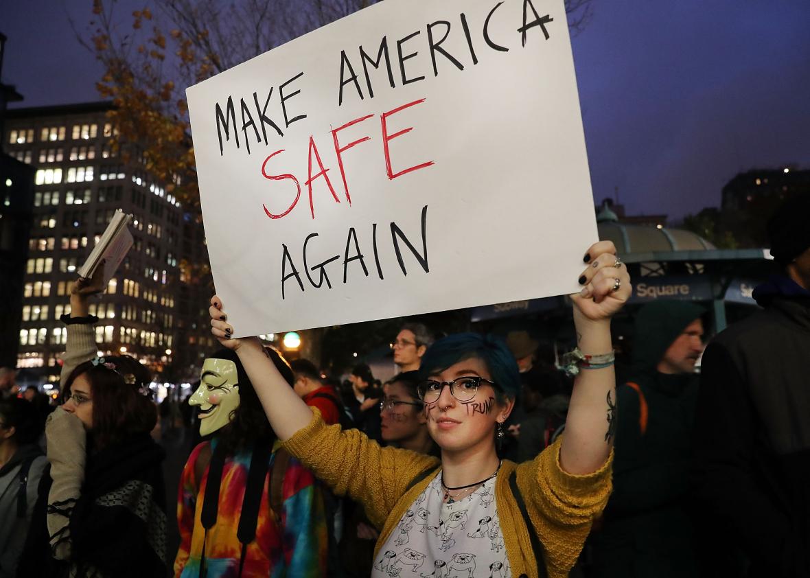 622088174-anti-trump-protesters-gather-in-a-park-as-new-yorkers