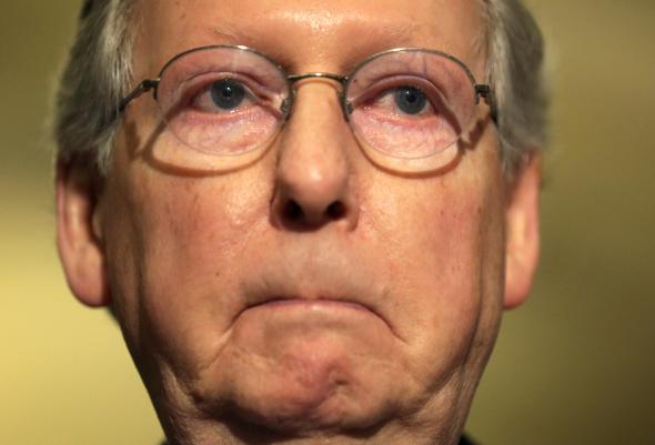 476810229-senate-minority-leader-sen-mitch-mcconnell-pauses