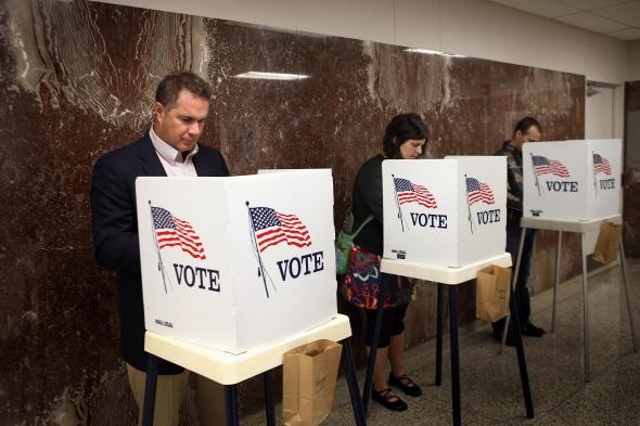 152841468-rep-bruce-braley-votes-during-early-voting-at-the-black