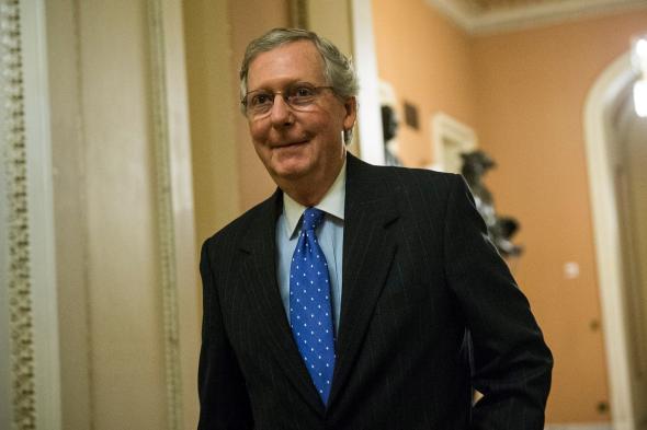 184798110-senate-minority-leader-sen-mitch-mcconnell-walks-to-the