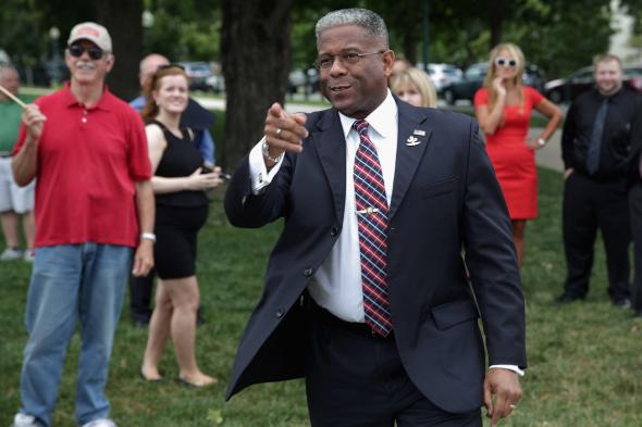 174288797-former-rep-allen-west-spots-a-friend-in-the-crowd_1