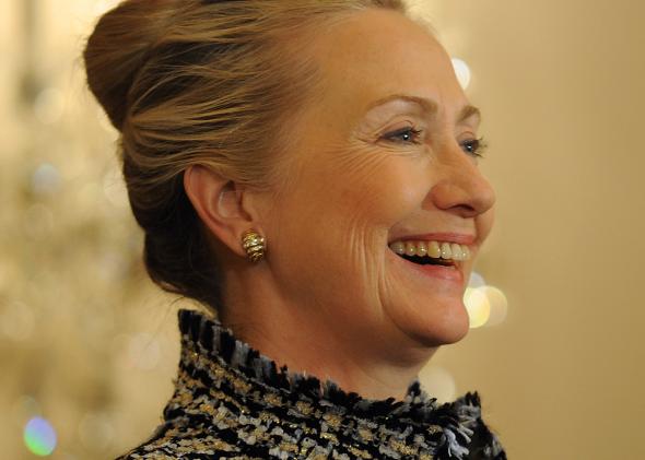 136703607-secretary-of-state-hillary-clinton-smiles-at-a-remark