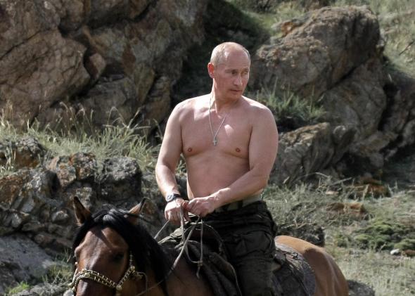 89594251-russian-prime-minister-vladimir-putin-rides-a-horse