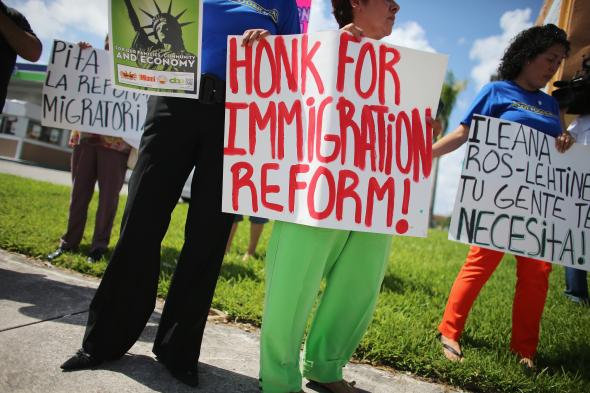 176648776-protesters-stand-together-as-they-hold-a-protest-to-ask