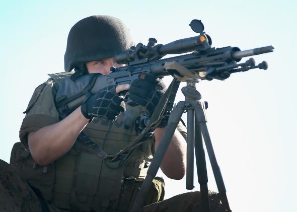 453575498-police-officer-keeps-watch-over-demonstrators