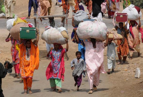 Women carrying parcels on their heads.