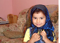 Larissa plays dress-up with a traditional gypsy scarf