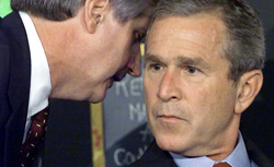 US President George W. Bush has his early morning school reading of 'My Pet Goat' interrupted by his Chief of Staff Andrew Card (L) shortly after news of the New York City airplane crashes was available in Sarasota, Florida. Click image to expand.