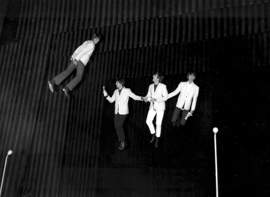 The Beatles, from left, Ringo Starr, Paul McCartney, John Lennon and George Harrison, are suspended in midair above the stage during rehearsal for their part in the charity show &quot;Night of 100 Stars&quot;.