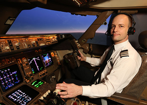 Mark Vanhoenacker in the cockpit of a Boeing 747-400.