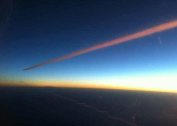 Twin contrails at dawn over the Mediterranean, en route from Cap