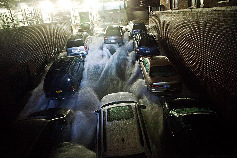 Rising water, caused by Hurricane Sandy, rushes into a subterranian parking garage on October 29, 2012.