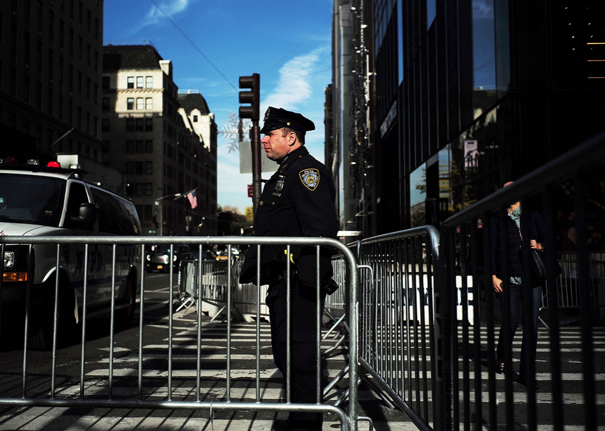 New York Police Department (NYPD) officers guard near Trump Tower, where US President-elect Donald Trump holds meetings, in New York on November 14, 2016. 