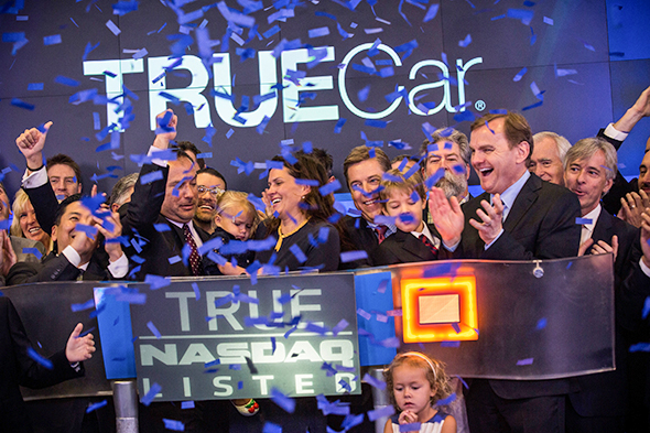 Employees of TrueCar celebrate the company&rsquo;s IPO while ringing the opening bell for the Nasdaq exchange on May 16, 2014, in New York City
