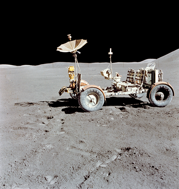 The Lunar Roving Vehicle (LRV) photographed alone against the desolate lunar background during the third Apollo 15 lunar surface extravehicular activity (EVA) at the Hadley-Apennine landing site, August 1971. 