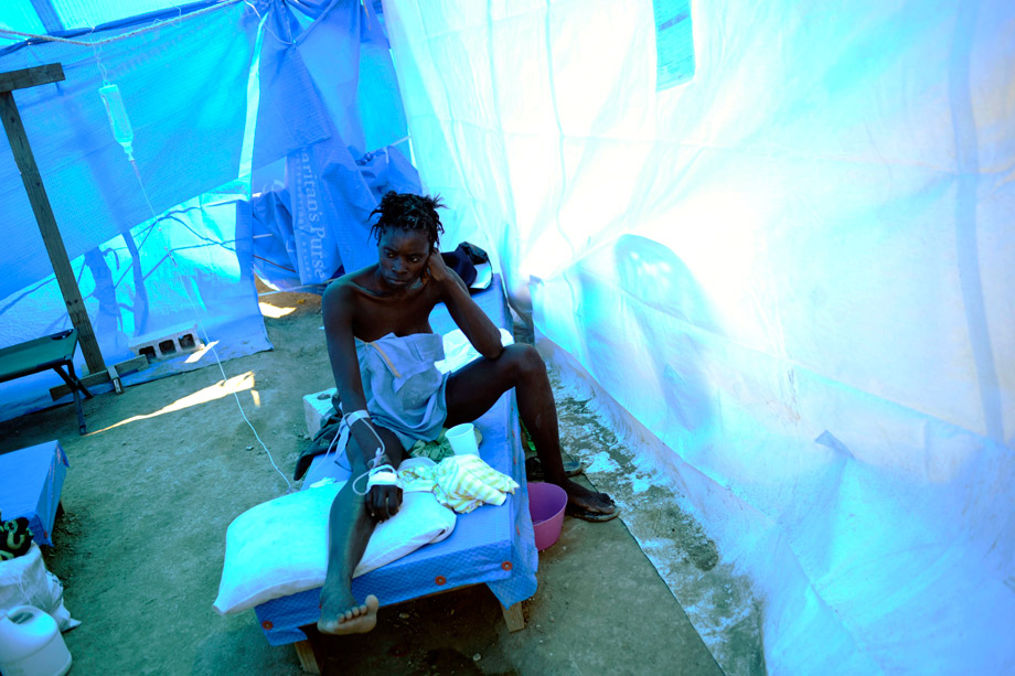 A woman infected with cholera receives treatment in a clinic set up by the aid agency Samaritan's Purse in Cabaret, Haiti, Nov. 26, 2010. A raging cholera epidemic in Haiti may deter some voters from participating in Sunday's national elections, but postponing or canceling the polls could threaten stability in the Caribbean country, the European Union's envoy said on Monday.