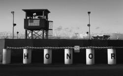 A U.S. military guard tower stands on the perimeter of a detainee camp at the U.S. detention center for &quot;enemy combatants&quot; on September 16, 2010 in Guantanamo Bay, Cuba.