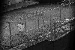 130411_FOR_slahi30 Detainees jog inside a recreation yard at Camp 6 in the Guantanamo Bay detention center on March 30, 2010 in Guantanamo Bay, Cuba.