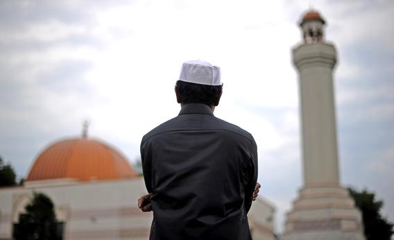 A Muslim takes part in a special morning prayer to start Eid-al-Fitr festival, marking the end of their holy fasting month of Ramadan, at a mosque in Silver Spring, Maryland, on August 19, 2012.