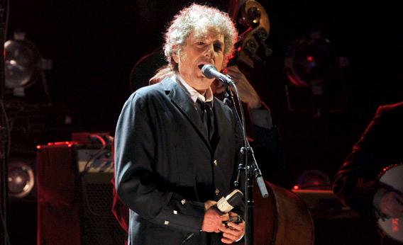 Bob Dylan performs onstage.