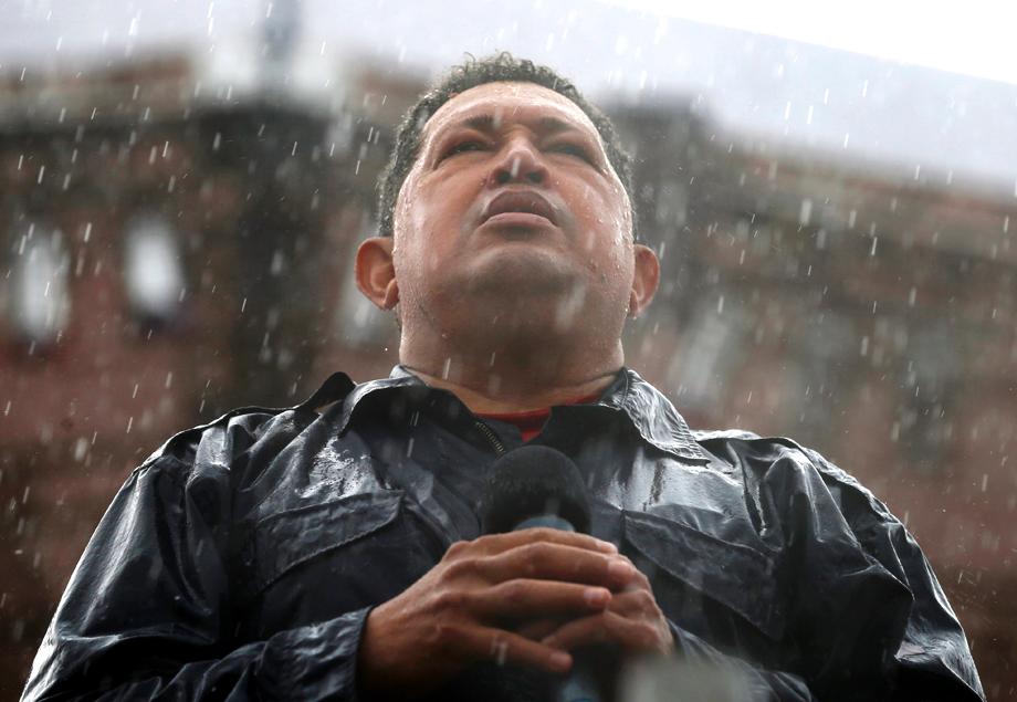 Chavez speaks in the rain during a campaign rally in Caracas, Oct. 4, 2012.