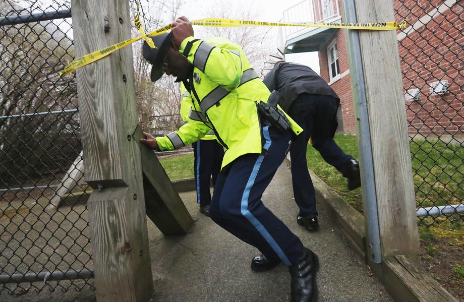  Police search for one remaining suspect at an apartment building where a resident reported finding drops of blood on April 19, 2013 in Watertown, Massachusetts. Earlier, a Massachusetts Institute of Technology campus police officer was shot and killed at the school's campus in Cambridge. 