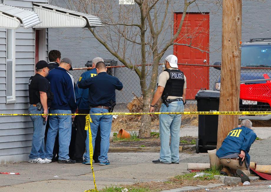 FBI agents search for the Boston Marathon bombing suspects in Watertown, Massachusetts April 19, 2013.  