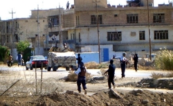 Masked militiamen in track suits join an Iraqi army-police show of force. Masked militiamen in track suits join an Iraqi army-police show of force