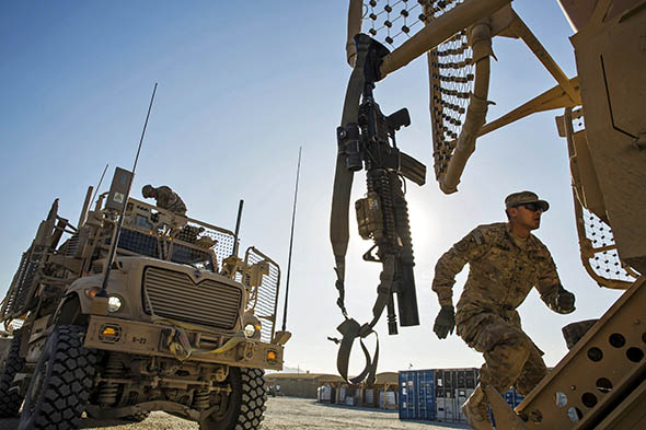 U.S. soldier prepares for a mission on Forward Operating Base Gamberi in the Laghman province of Afghanistan on Dec. 28, 2014.