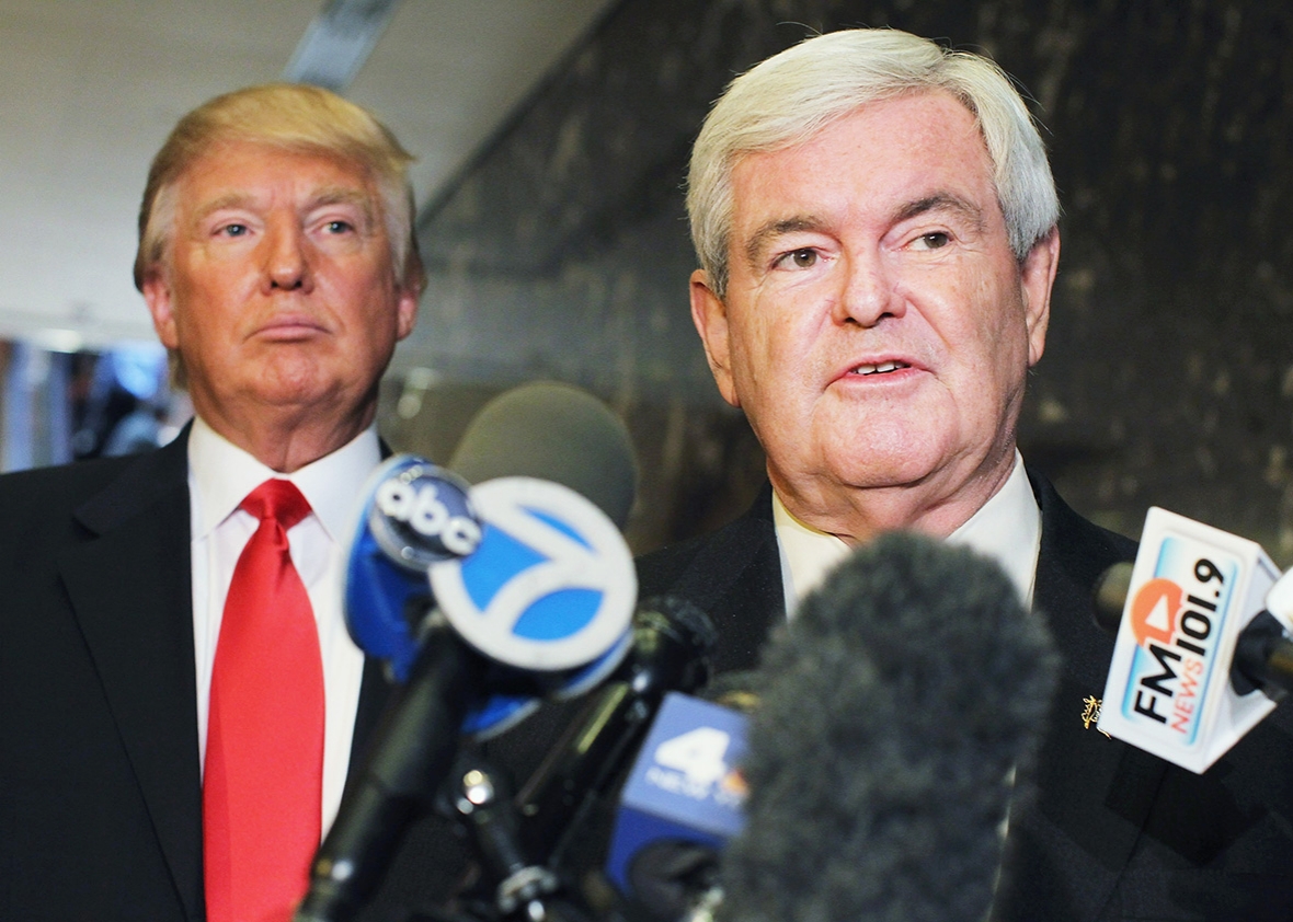 Republican presidential candidate and former Speaker of the House Newt Gingrich speaks to the media as Donald Trump listens at Trump Tower following a meeting between the two on December 5, 2011 in New York City. 