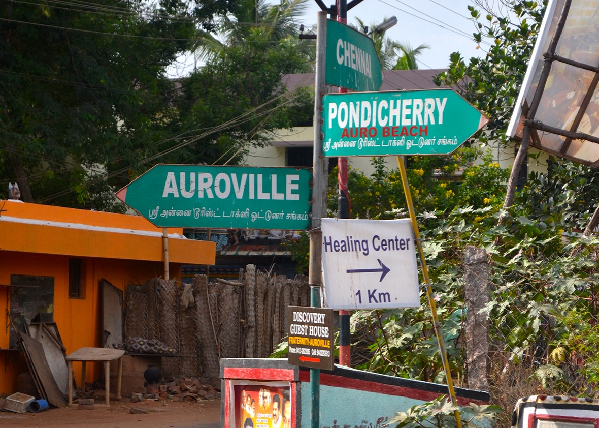 On the outskirts of the township, a sign points visitors towards Auroville.