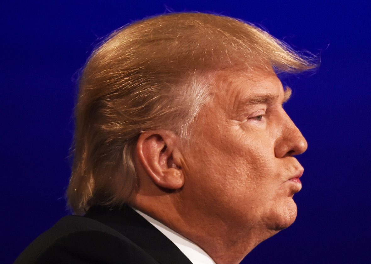 Republican nominee Donald Trump looks on  during the first presidential debate at Hofstra University in Hempstead, New York on September 26, 2016. 