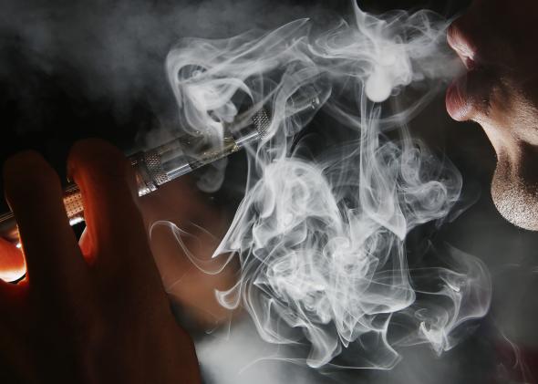 454245788-in-this-photo-illustration-a-man-smokes-an-e-cigarette Vape