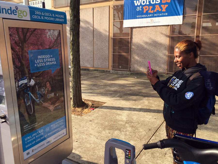 Hill won an essay contest about how much she loves Indego. Her prize? Her picture on a bikeshare kiosk. This is the first time Hill has seen her image on the kiosk.