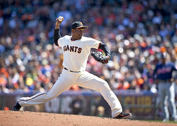 Santiago Casilla #46 of the San Francisco Giants pitches against the Cleveland Indians.