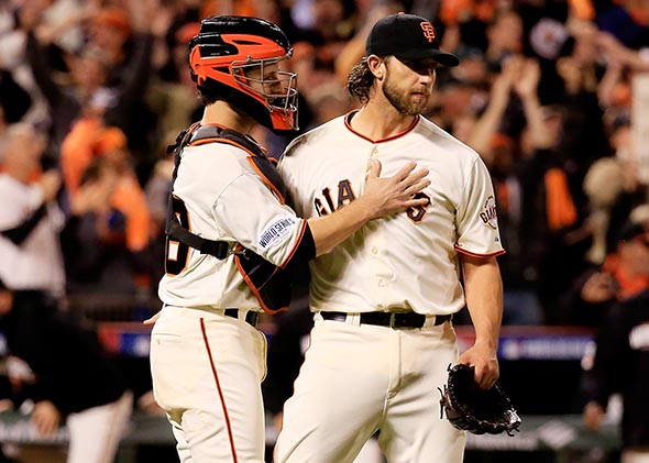 140227_SNUT_MadisonBumgarner Madison Bumgarner #40 celebrates with Buster Posey #28 of the San Francisco Giants after defeating the Kansas City Royals 5-0 in Game Five of the 2014 World Series.