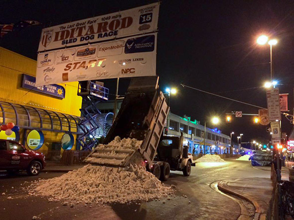 Snow is trucked in on March 7, 2015, for the ceremonial Iditarod start line in Anchorage, Alaska