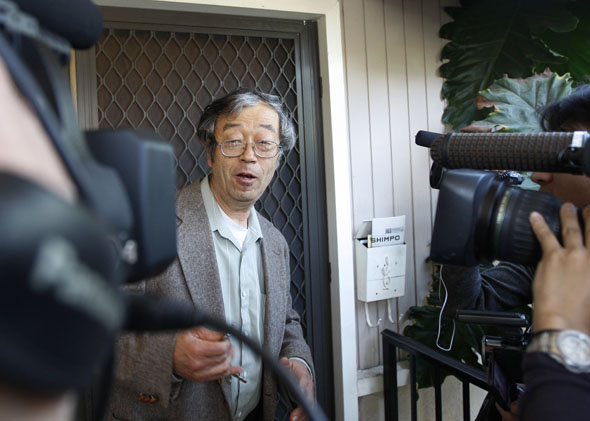 140307_LOW_DorianNakamoto Dorian Nakamoto, widely believed to be Bitcoin currency founder, is surrounded by reporters as he leaves his home in Temple City, California March 6, 2014.