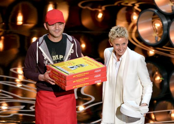 476275539-host-ellen-degeneres-with-pizza-delivery-man-onstage